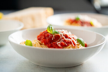 Spaghetti with tomato sauce and basil on a plate