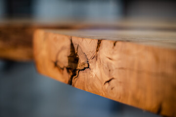 Closeup of a wooden table with natural and solid wood top