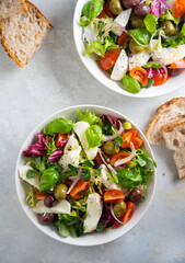 Fresh green salad with cherry tomato, mozzarella and olives.