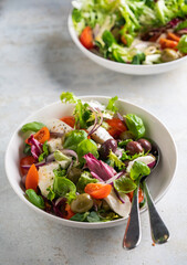 Fresh green salad with cherry tomato, mozzarella and olives.