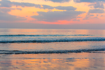 Amazing sunset over the ocean. Beautiful clouds and sun. Bright colors. 