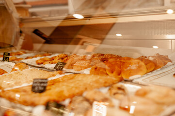 Bakery glass counter full of pastries display