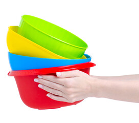 Colorful plastic bowl in hand on white background isolation