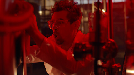 Scientist panicking in large laboratory during emergency
