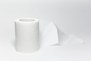 Close-up of toilet paper roll on white background.