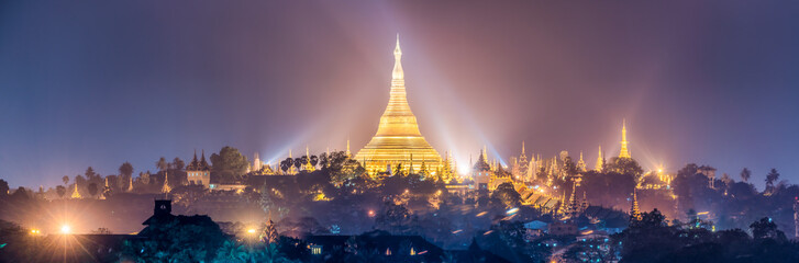 Panoramic view of the golden Shwedagon Pagoda at night, Yangon, Myanmar