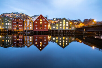 Fototapeta na wymiar Early morning by the Nidelven - Old sea house - Warehouse by the river in Trondheim city,Trøndelag county,Norway,scandinavia,Europe