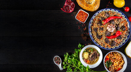 The concept of oriental cuisine. Assorted Uzbek food set, pilaf, samsa, lagman, manta, shurpa central asia food. Homemade Uzbek pilaf or plov from lamb served in cast iron cookware