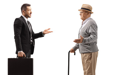 Fototapeta premium Businessman with a case having a conversation with an elderly gentleman