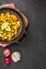 top view fried potatoes inside pan with lemon on the dark background dish cuisine meal food color dinner