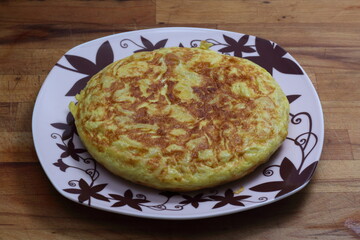 spanish omelette served into a plate