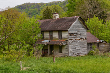 Abandoned homes seen from a country road in rural Tennessee.