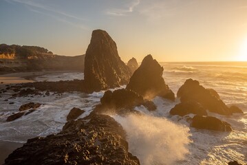Sunset and crashing waves at seal rock park on the Oregon coast - 399819321