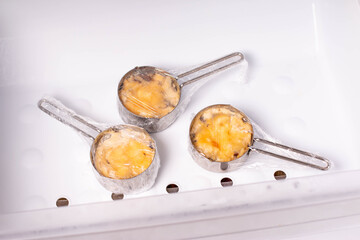 Frozen food in the freezer. Frozen julienne. Mushroom, chicken and cheese gratin in bowls, container, bags