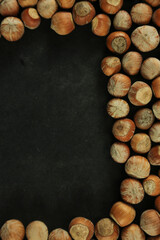 Hazelnuts on wooden backdrop. heap or stack of hazelnuts. healty food