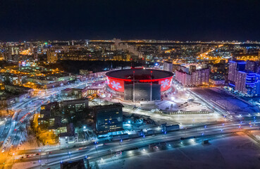 Fototapeta na wymiar Aerial view of stadium with night illumination and residential buildings in the center of Yekaterinburg. Russia