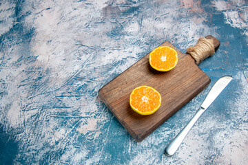 Fototapeta na wymiar front view fresh tangerine slices on light-blue background citrus juice fruit tree photo color