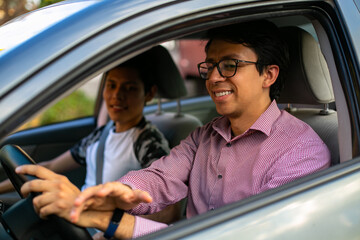 Learning to drive. Two young men in a driving session