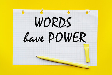 WORDS HAVE POWER inscription on white list, yellow pen on a yellow background. a bright solution for business, financial, marketing concept