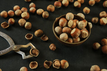 Hazelnuts on wooden backdrop. heap or stack of hazelnuts. healty food