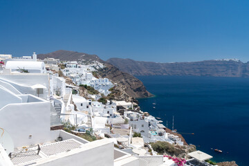 Balconies and roof tops in the village of Oia, Santorini. Architecture and landscape of Greece. Amazing panoramic view.