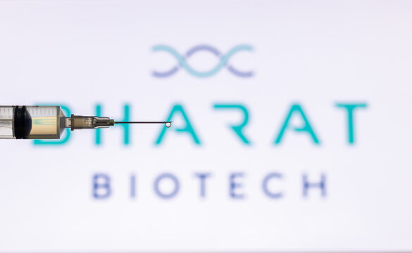 Closeup Of Syringe Injection Full Of Vaccine Against Bharat Biotech Logo.