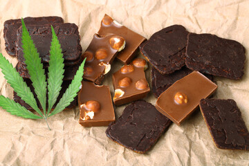 Hemp Chocolate Chip Cookies with THC and CBD. Organic Marijuana Chocolate Chunks with Nuts and CBD Cannabis Supplement and Green Hemp Leaves