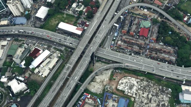 Aerial Shot Of Cars Driving On City Roads And Infrastructure In Kuala Lumpur, Malaysia