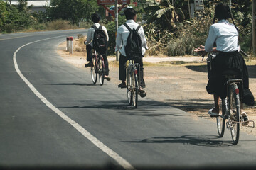 students riding their bikes to school