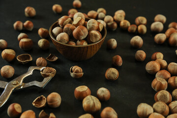 Hazelnuts on wooden backdrop. heap or stack of hazelnuts. healty food