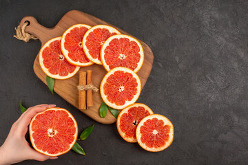 top view fresh grapefruit slices on dark background diet fruit healthy life juice fresh color