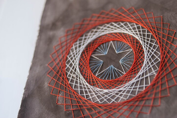 Embroidery. Handmade. Isothread. Star on a white-red blue background. Captain America. Creation.