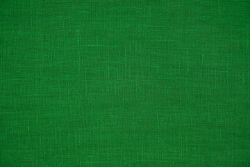 Natural linen fabric. Green fabric texture for background. Copy space. Top view.