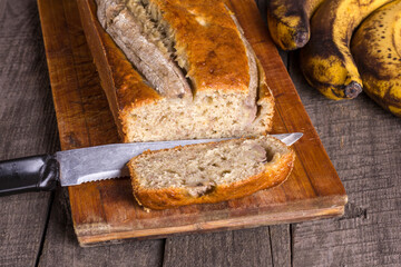 Traditional american dish sliced banana bread without gluten and dairy products on wooden background