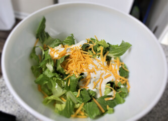 Salad with cheese and ranch dressing