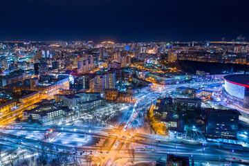 Fototapeta na wymiar Aerial view of the night modern city. Bright lights of the night streets. Ekaterinburg. Russia