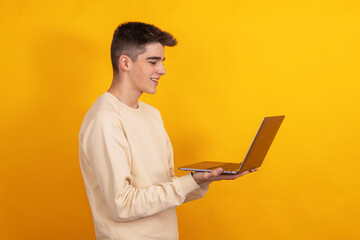 young student or teenager with laptop isolated on background