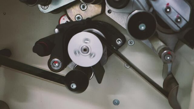 film projectors and 35mm film reels.Section of 35mm projector mechanism.
