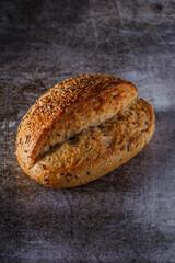 Assortment of baked bread on wooden table background Fresh fragrant bread on the table. Food concept.