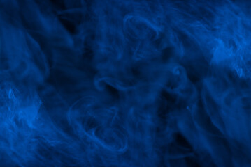 Blue steam on a black background.
