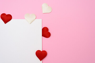 Valentines day or wedding mockup scene with blank card, paper hearts confetti, empty space for your text, top view