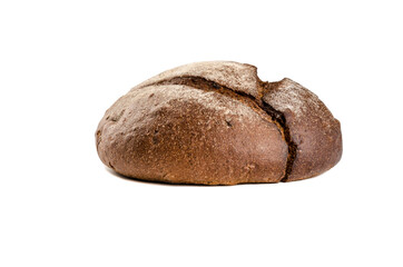 Baked round bread made from dark flour. Side view