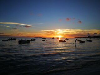Sunset on exotic island with boats, Seychelles, Praline