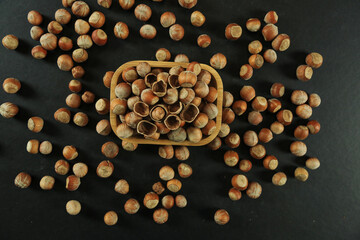 Hazelnuts on wooden backdrop. heap or stack of hazelnuts. healty food