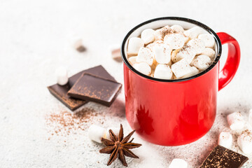 Hot chocolate with marshmallow in red mug.