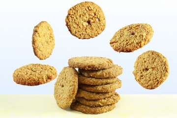 traditional homemade tea time snack oatmeal cookies with flying or falling cookies 