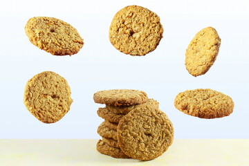 traditional homemade tea time snack oatmeal cookies with flying or falling cookies 