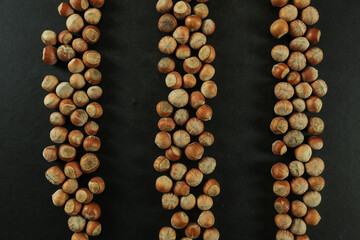 Hazelnuts on wooden backdrop. heap or stack of hazelnuts. healty food