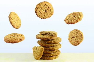 traditional homemade tea time snack oatmeal cookies with flying or falling cookies 