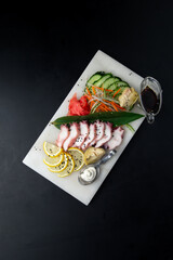 Octopus sashimi with vegetables and soy sauce